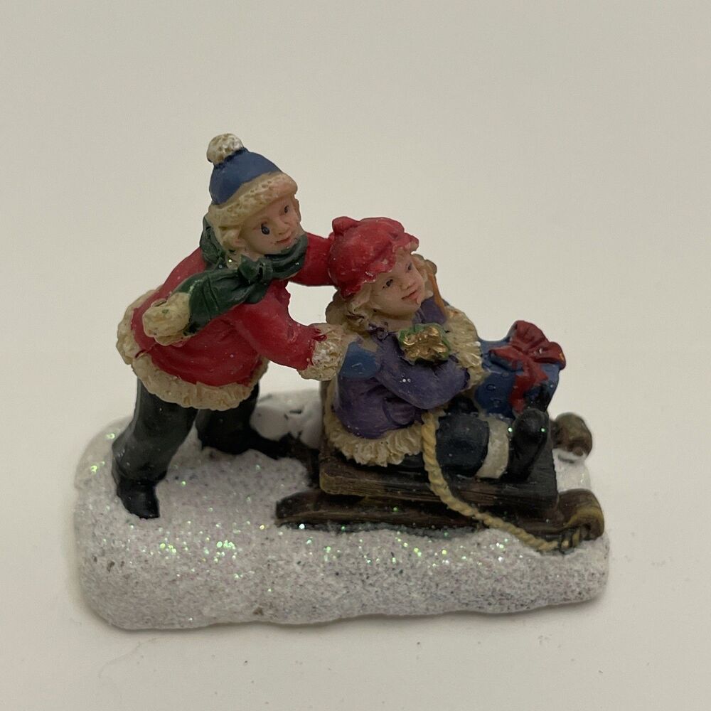 Celebrations Christmas Village Snowy 2 Kids Sledding 2 Inches Tall Glittery Snow
